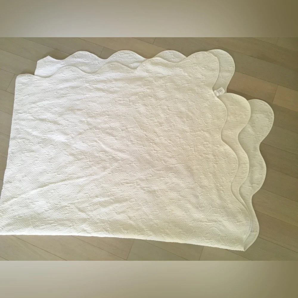 white matelassé coverlet